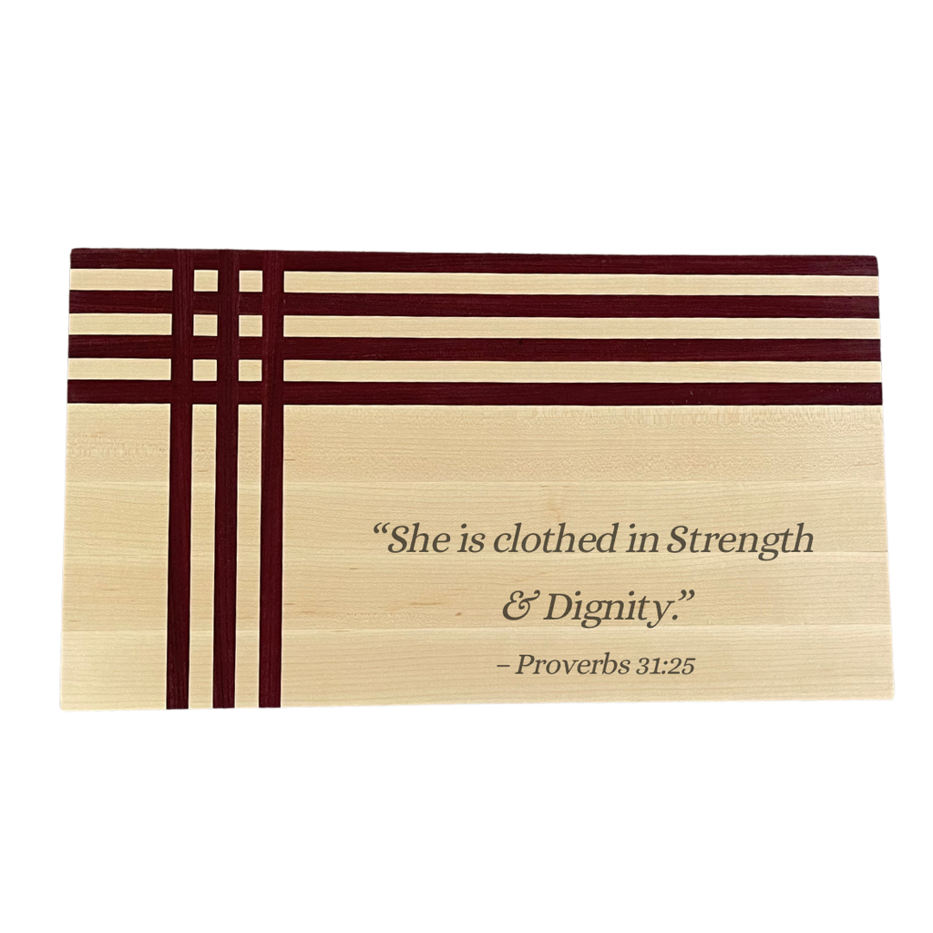 Maple and purpleheart board engraved with She Is Clothed in Strength and Dignity Proverbs 31:25