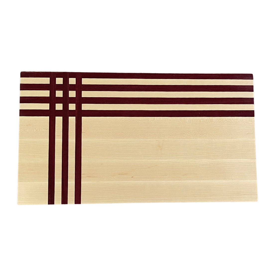 Maple and purpleheart geometric inlay cutting board handcrafted by Combat Wounded Designs